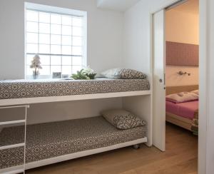 Llit o llits en una habitació de Casa Smith