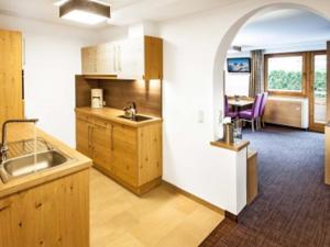 a kitchen with a sink and a counter top at Landhaus Gappmaier in Saalbach Hinterglemm