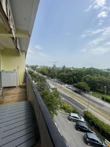 a balcony with a view of a road and cars at Chambre meublé Lormont in Lormont
