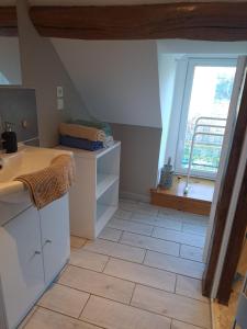 a kitchen with a sink and a window at La Petite Longère in Talcy +9 photos
