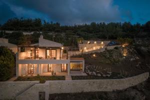 an aerial view of a house at night at Forest Within - Wellness Villa in Archanes in Káto Arkhánai