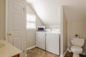 a small bathroom with a toilet and a sink at Boat House in Downingtown +16 photos
