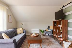 a living room with a couch and a table at Boat House in Downingtown