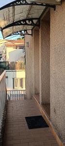 an outside walkway with awning on the side of a building at Studio Emilie in Balaruc-les-Bains +14 photos