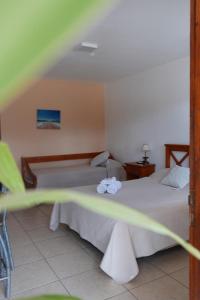 Giường trong phòng chung tại Aparthotel Agave +8 ảnh