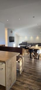 a living room with a couch and a table at Central Apartment in Radstadt