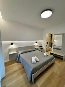 En eller flere senge i et værelse på Lungomare Vazzana