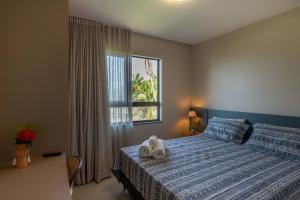 Postel nebo postele na pokoji v ubytování Viva com Conforto e Clima de Resort - Pé na areia + 32 fotografií