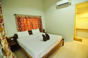 Katil atau katil-katil dalam bilik di Phi Phi Twin Palms Bungalow
