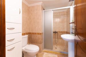 a bathroom with a toilet and a sink and a shower at Villa Dreamy View in Agia Ermioni +43 photos
