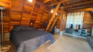 TV a/nebo společenská místnost v ubytování Chalé Toledo e Costa II