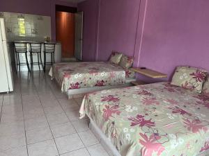 En eller flere senge i et værelse på Hotel Diana cazadora