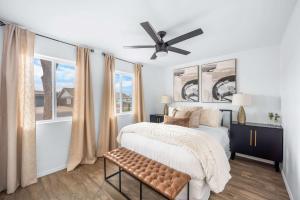 a bedroom with a bed and a ceiling fan at Private Pool Haven Backyard & Putting Green in Phoenix