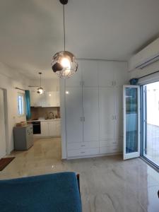 Kuchyň nebo kuchyňský kout v ubytování Nympes Melody - Golden Harmony Stay