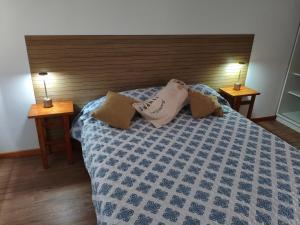 En eller flere senge i et værelse på Tu otro departamento en Olavarría te espera!