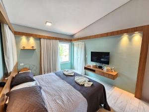 Postel nebo postele na pokoji v ubytování Chalé de Luxo no Meridional Club Praia dos Carneiros + 55 fotografií