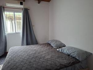 En eller flere senge i et værelse på Casa Bianca