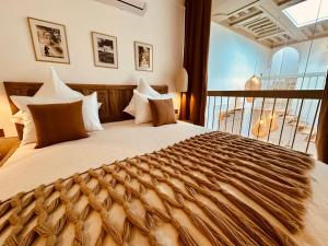 a bedroom with a large bed with a large window at Riad Jardin Des Sens & Spa in Marrakech +70 photos