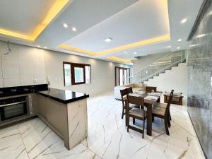 Køkken eller tekøkken på Eficiência - Casa Recanto dos Ventos