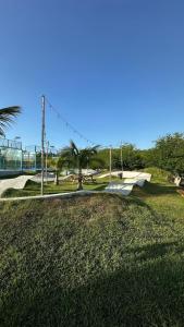 a skate park with ramps and palm trees in a park at Ideal home to relax and enjoy with family in El Nance