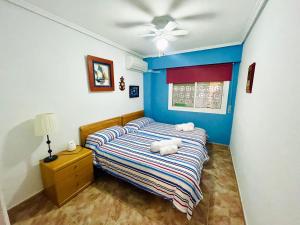 Giường trong phòng chung tại Apartamento en Primera Línea de playa