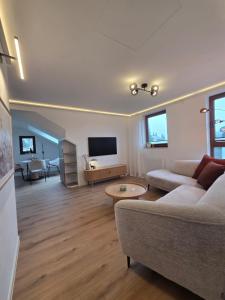 Un televizor și/sau centru de divertisment la Haus Daut FeWo mit Hallenbad