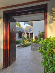 an open door of a house with a patio at Bula Lodge Guest House in Nadi