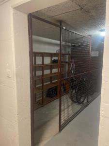a room with a bike in a cage at Sunflower in Kranjska Gora +2 photos