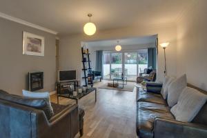 a living room with two couches and a television at 2 Bed in Llanmadoc oc-hh2110 in Llanmadoc