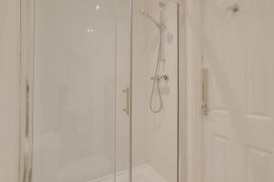 a bathroom with a shower with a glass door at 2 Bed in Llanmadoc oc-hh2110 in Llanmadoc +22 photos