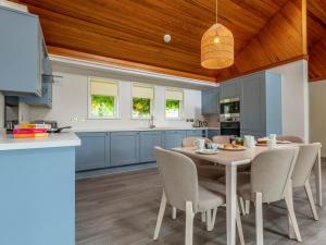 a kitchen and dining room with a table and chairs at 3 Bed in Saltash oc-87711 in St. Mellion