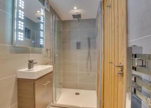 a bathroom with a shower and a sink at 3 Bed in Bala oc-bow69 in Bala +18 photos