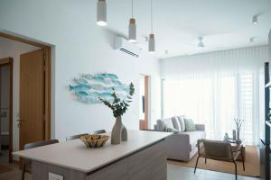 Et opholdsområde på Naccara Luxe Apartment Grand Baie Beachside