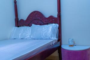 Postel nebo postele na pokoji v ubytování Modern Oasis 5 Mins to Acacia Mall CJs and Padel