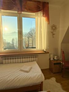 Postel nebo postele na pokoji v ubytování Kramarzówka - Gospodarstwo Turystyczne Centrum Bukowiny