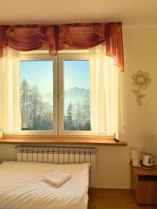 Postel nebo postele na pokoji v ubytování Kramarzówka - Gospodarstwo Turystyczne Centrum Bukowiny + 40 fotografií