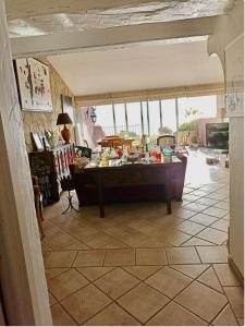 a living room with a table in the middle at Paradis bleu in Agay - Saint Raphael