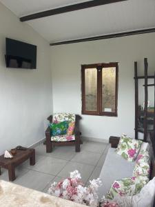 Et tv og/eller underholdning på Raízes Pousada