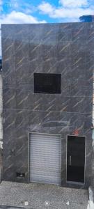 a building with a door on the side of it at Loft confortável in Morro do Chapéu