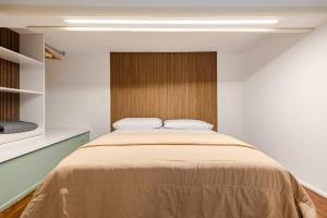 a bedroom with a large bed in a room at Living Calabriando in Reggio di Calabria