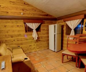 Et opholdsområde på Parque Girasoles Balneario & Cabañas