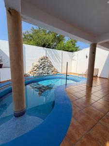 a swimming pool in a house at Casa Vemisa Puerto Escondido in Puerto Escondido