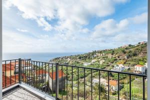 a balcony with a view of the ocean at Casa da Feira - Located in a peaceful Calheta area with sea views in Calheta +23 photos
