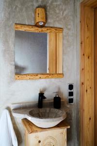 a bathroom with a sink and a mirror at Numidia Surf House in Mirleft +53 photos