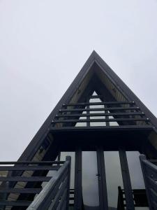 a roof of a building with glass windows at Hill House in Slobozia-Măgura