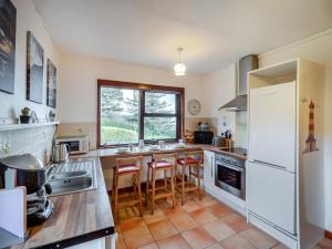 a kitchen with white appliances and a large window at 3 Bed in Inch oc-i304 in Anascaul +13 photos