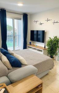 Μια τηλεόραση ή/και κέντρο ψυχαγωγίας στο Tu Lugar Soñado-Lifestyle Premium Pool-Confort