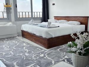 a bedroom with a bed with two dolls on it at NEW ASSER HOTEL PYRAMID in Cairo +96 photos