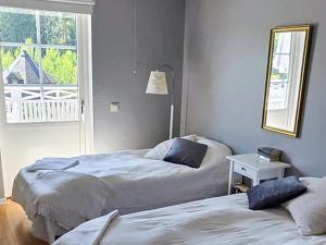 Postel nebo postele na pokoji v ubytování 5 star holiday home in VAXHOLM + 19 fotografií