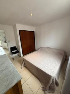 En eller flere senge i et værelse på Departamento Costa II